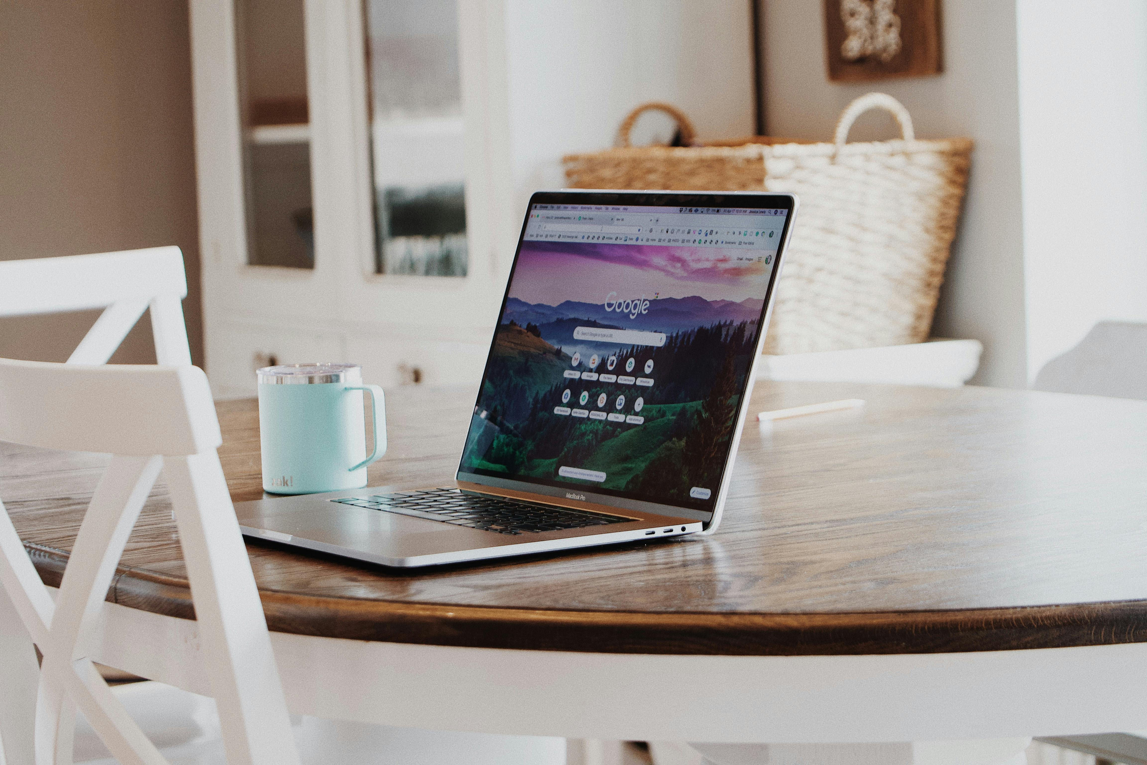 MacBook on brown table