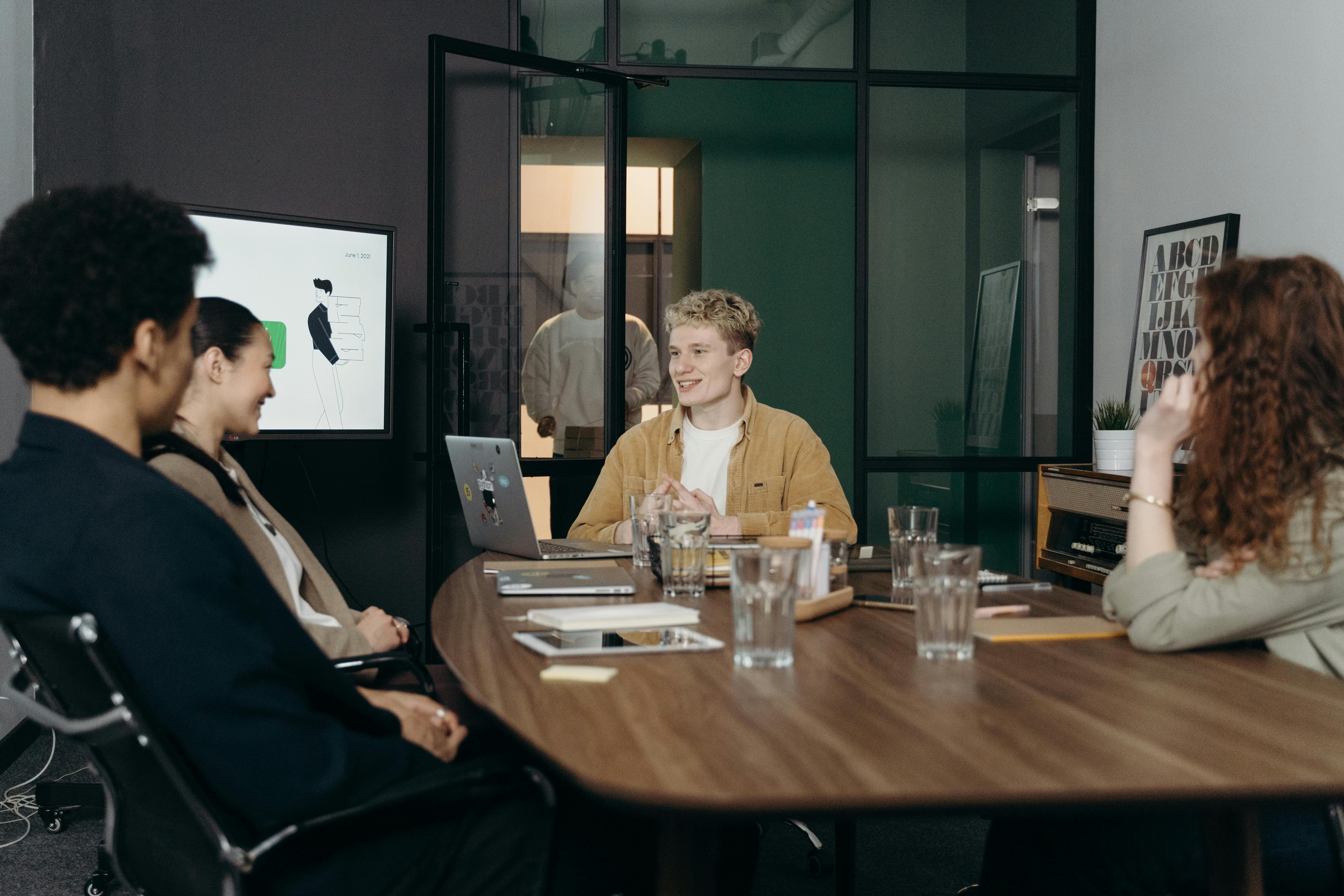 People sitting in a group around a table